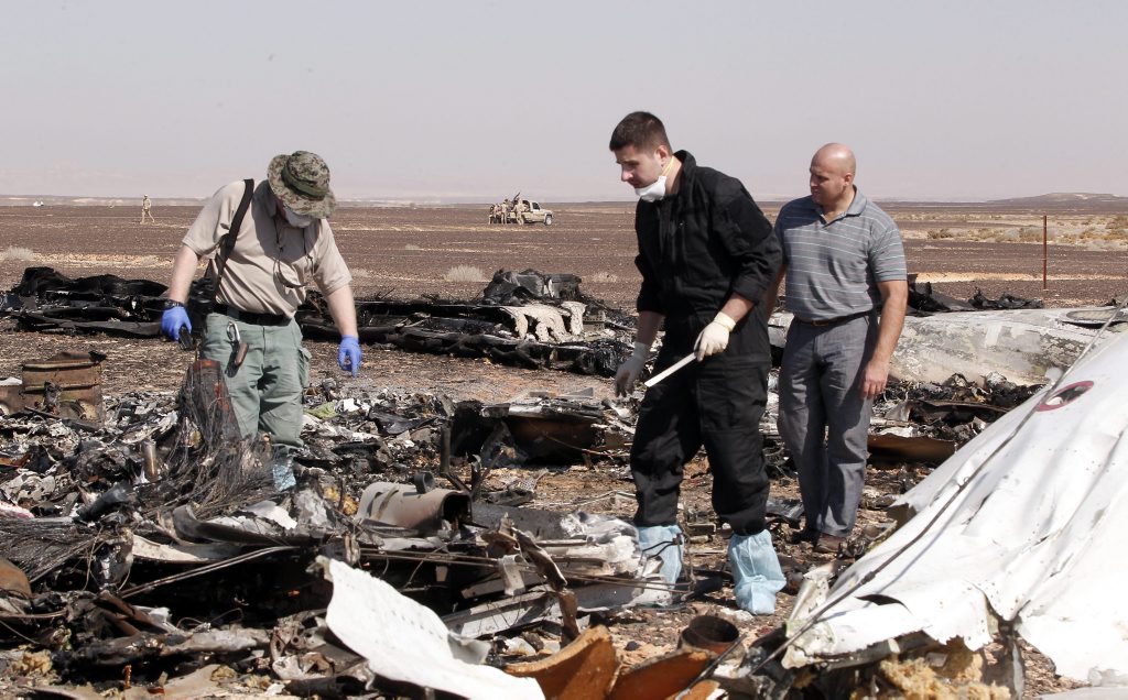 Russian investigators checking debris from crashed Russian jet at the site of the crash in Sinai, Egypt. EPA/KHALED ELFIQI Russian investigators checking debris from crashed Russian jet at the site of the crash in Sinai, Egypt. EPA/KHALED ELFIQI